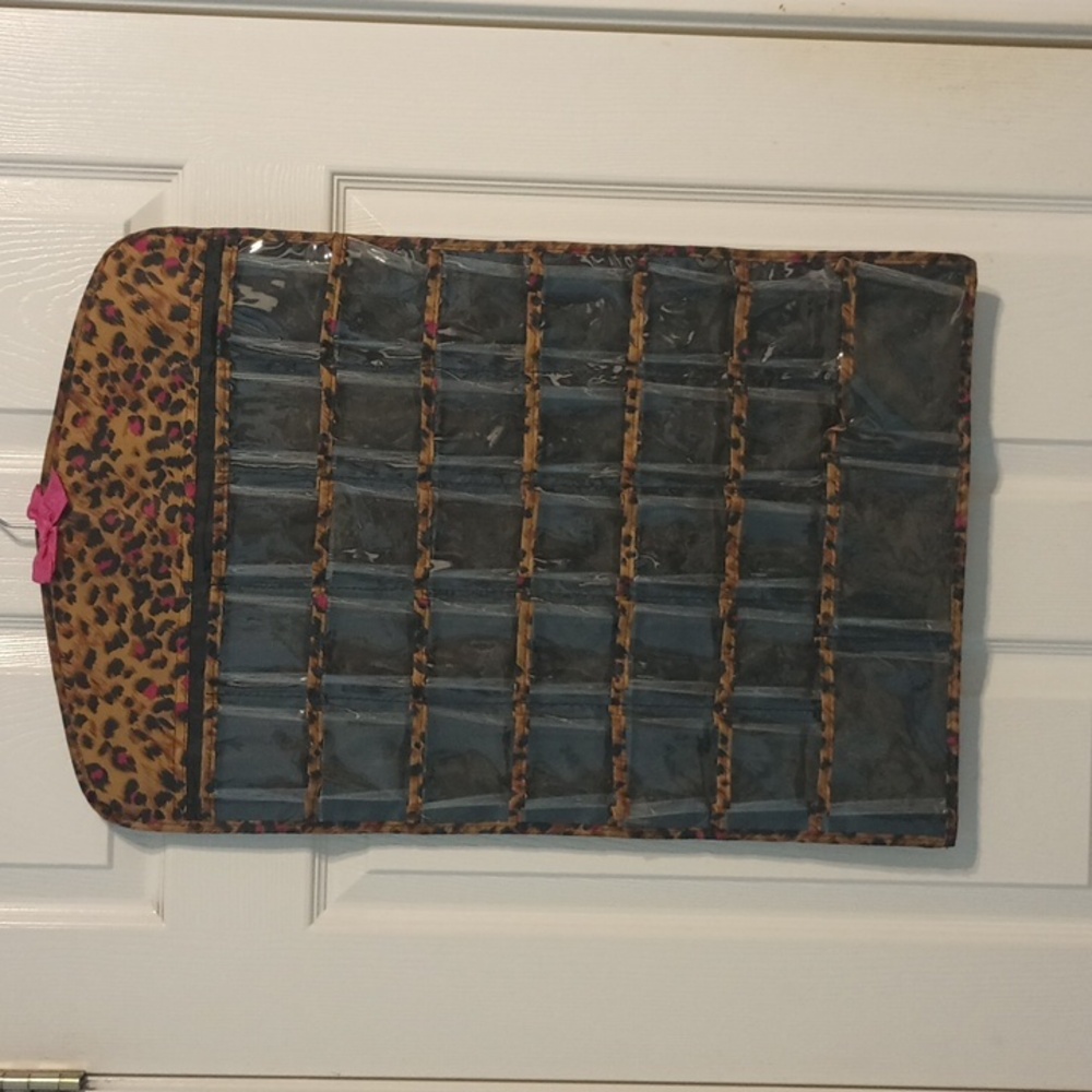 Jewelry Organizer 2 sided Totaling 66 Pockets. Made by Tri-Coastal Design.